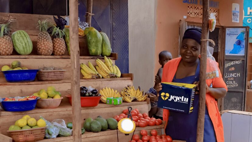Woman selling fresh produce at a local market.